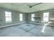 Large garage with three windows and installed shelving for organized storage at 2600 Henagan Ln., Myrtle Beach, SC 29588