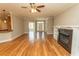 Open living area with hardwood flooring, a fireplace, and lots of natural light, perfect for entertaining at 2600 Henagan Ln., Myrtle Beach, SC 29588