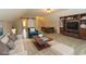 Staged living room with elegant furniture, a billiards table, and built-in shelving at 2600 Henagan Ln., Myrtle Beach, SC 29588