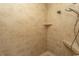 Walk-in shower featuring tiled walls and a built-in shower bench and shelving niche at 2600 Henagan Ln., Myrtle Beach, SC 29588