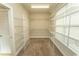 Spacious walk-in closet with abundant shelving and a carpeted floor at 2600 Henagan Ln., Myrtle Beach, SC 29588