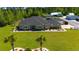 Stunning aerial view of custom home with lush lawn, professional landscaping and mature trees at 2767 Lees Landing Circle, Conway, SC 29526