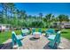 Outdoor fire pit area featuring Adirondack chairs and surrounded by lush landscaping at 2767 Lees Landing Circle, Conway, SC 29526