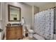 Traditional bathroom featuring a vanity with decorative mirror and a seashell-themed shower curtain at 2767 Lees Landing Circle, Conway, SC 29526
