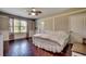 Comfortable bedroom featuring hardwood floors, ceiling fan, closet, and a bright window at 2767 Lees Landing Circle, Conway, SC 29526