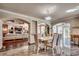 Dining area with chandelier and view into the open-concept living spaces at 2767 Lees Landing Circle, Conway, SC 29526