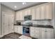 Kitchen with stainless steel appliances, tiled backsplash, and plentiful cabinet storage at 2767 Lees Landing Circle, Conway, SC 29526
