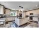Spacious kitchen featuring granite countertops, stainless steel appliances, and a center island with pendant lighting at 2767 Lees Landing Circle, Conway, SC 29526