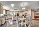 Modern kitchen features an island, stone floors and a dining area with seating for six at 2767 Lees Landing Circle, Conway, SC 29526