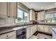Updated kitchen with custom cabinets, granite countertops, stainless steel dishwasher and a bright window above the sink at 2767 Lees Landing Circle, Conway, SC 29526