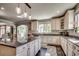 Large kitchen island with granite countertops and custom cabinets at 2767 Lees Landing Circle, Conway, SC 29526