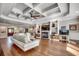 Spacious living room with a coffered ceiling, fireplace and hardwood floors throughout at 2767 Lees Landing Circle, Conway, SC 29526