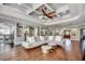 Expansive living room with coffered ceiling, hardwood floors and views of kitchen at 2767 Lees Landing Circle, Conway, SC 29526