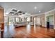 Spacious living room with hardwood floors, coffered ceiling and open access to the kitchen at 2767 Lees Landing Circle, Conway, SC 29526