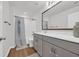 Well-lit bathroom features a tub/shower combination, a large mirror, and a vanity offering a functional space at 302 Portofino Dr., Myrtle Beach, SC 29579