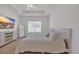 Bright bedroom features a large window, comfy bed, full length mirror, and a TV, creating a peaceful retreat at 302 Portofino Dr., Myrtle Beach, SC 29579