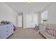 Bright Bedroom with a crib, toys, a slide, and a dresser providing a functional and cheerful space at 302 Portofino Dr., Myrtle Beach, SC 29579
