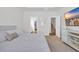 Bright bedroom features a comfortable bed and doorways to the bathroom and stairs, perfect for relaxing at 302 Portofino Dr., Myrtle Beach, SC 29579