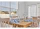Cozy dining room with modern decor, wood table, seating for six, and plenty of natural light at 302 Portofino Dr., Myrtle Beach, SC 29579