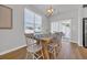 Bright dining room with a farmhouse table, seating for six, and access to the backyard at 302 Portofino Dr., Myrtle Beach, SC 29579