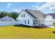 Charming home exterior with white siding, a well-kept lawn, and manicured landscaping at 302 Portofino Dr., Myrtle Beach, SC 29579