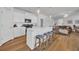 Bright kitchen featuring stainless steel appliances, white cabinetry, and a center island with bar seating at 302 Portofino Dr., Myrtle Beach, SC 29579