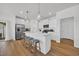 Modern kitchen featuring stainless steel appliances, white cabinetry, and a center island with bar seating at 302 Portofino Dr., Myrtle Beach, SC 29579