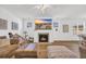 Cozy living room featuring a fireplace, and seamlessly connecting to the dining area and kitchen at 302 Portofino Dr., Myrtle Beach, SC 29579