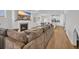 Open-concept living room featuring a fireplace, wood floors, and seamlessly connecting to the kitchen and dining area at 302 Portofino Dr., Myrtle Beach, SC 29579
