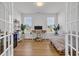 Bright office features a desk, a bed, plants, and a wine cooler providing a productive and stylish workspace at 302 Portofino Dr., Myrtle Beach, SC 29579