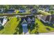 Aerial view of a landscaped home with a well manicured lawn, a pool, and a long driveway at 304 San Martin Ct., Longs, SC 29568