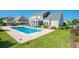 Backyard with a swimming pool, lounge chairs, outdoor seating and views of the home at 304 San Martin Ct., Longs, SC 29568