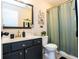 Classic bathroom with black vanity, modern hardware, and elegant mirror creating a functional and stylish space at 304 San Martin Ct., Longs, SC 29568