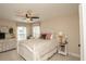 Inviting bedroom with natural light, decorative pillows, ceiling fan, and dresser creating a comfortable and stylish retreat at 304 San Martin Ct., Longs, SC 29568