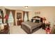 Luxurious bedroom with warm tones, a large bed, and natural light creating a relaxing and inviting space at 304 San Martin Ct., Longs, SC 29568