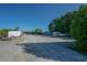 Gravel boat storage area featuring a selection of trailers and boats under a clear blue sky at 304 San Martin Ct., Longs, SC 29568