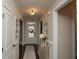 Inviting foyer with a decorative glass front door, neutral walls, dark hardwood floors and elegant decor at 304 San Martin Ct., Longs, SC 29568