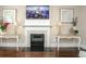 Elegant fireplace with tile surround and decorative mantel, flanked by accent tables at 304 San Martin Ct., Longs, SC 29568