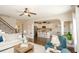 Spacious living room showcasing the open layout to the kitchen and staircase at 304 San Martin Ct., Longs, SC 29568