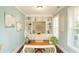Stylish home office with built-in shelving, light blue walls, and a window for natural light at 304 San Martin Ct., Longs, SC 29568