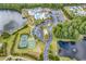 Aerial view of neighborhood amenities including pool, tennis courts, basketball court and lake at 3119 Hannon Dr., Myrtle Beach, SC 29579
