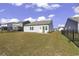 A spacious backyard with lush lawn offers privacy with a fence and is ready for outdoor activities at 3119 Hannon Dr., Myrtle Beach, SC 29579