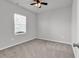 A naturally lit bedroom offers a ceiling fan, neutral color scheme, and comfortable carpeted flooring at 3119 Hannon Dr., Myrtle Beach, SC 29579