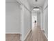 Bright hallway featuring wood floors, modern lighting, and open doorways leading to other rooms in the home at 3119 Hannon Dr., Myrtle Beach, SC 29579