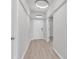 Bright hallway featuring wood floors, modern lighting, and open doorways leading to other rooms in the home at 3119 Hannon Dr., Myrtle Beach, SC 29579