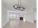 Bright living room with modern lighting, fireplace, and large windows at 3119 Hannon Dr., Myrtle Beach, SC 29579
