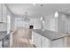 Open-concept living room featuring a fireplace and an eat-in kitchen at 3119 Hannon Dr., Myrtle Beach, SC 29579