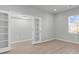 Well-lit living room with wood floors, neutral walls, glass paneled doors and a window with blinds at 3119 Hannon Dr., Myrtle Beach, SC 29579