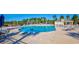 Large pool with clear, blue water and lounge seating with shaded umbrellas at 3119 Hannon Dr., Myrtle Beach, SC 29579