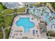 Aerial shot of the pool area showcasing a large pool with sun loungers and umbrellas at 3119 Hannon Dr., Myrtle Beach, SC 29579